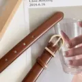 Women's brown leather belt with gold buckle stylish accessory for jeans and dresses. - Camel