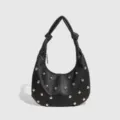 Black leather rivet hobo shoulder bag with metal studs and knotted handle for women. - Black