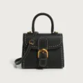 Classic black leather top-handle handbag with white stitching and gold hardware for women. - 21*10.5*17cm / Black