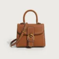 Brown leather handbag with horseshoe buckle and white stitching, chic top handle crossbody bag. - 21*10.5*17cm / Brown