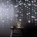 Detailed scene shot of hanging iridescent 3D heart and star garland for party decor. - 3m Iridescent Hollow Heart Garland