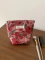 Close-up detail of retro floral jacquard cosmetic pouch showcasing exquisite woven texture. - S / Vintage Red Rose