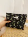 Floral makeup bag detail, black fabric with colorful floral pattern, portable storage pouch. - L / Black Background Small Floral