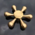 Detailed close-up shot of the six-bladed solid brass hand fidget spinner toy mechanism. - Pure Copper Detachable - CT-04 Teardrop Model