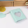 Close-up detail of the mint green heart photocard holder binder with cute pendant. - 3-Inch 32 Pockets / Jelly Mint