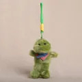 Plush toy keychain pendant with cute green doll and mini scarf, soft bag accessory. - Dressed Animal Pendant - Dinosaur / Approx 15cm