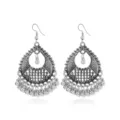 Detailed shot of vintage silver teardrop earrings with bead tassels and bohemian design. - 7