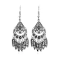 Close-up detail of vintage silver bohemian style dangle earrings with delicate filigree work. - 8