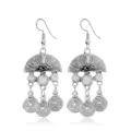 Detailed close-up of retro bohemian alloy dangling earrings with intricate spiral pendant motifs. - Style 4