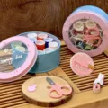 Portable round sewing box set with colorful thread spools, scissors, and needles for home mending. - 5906 Iron Can Sewing Box 12 Colors Threads