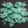 Detailed shot of mint green satin ribbon bows, soft double layer DIY accessory material - 2.5cm Width (10 Pieces/Pack) / Green