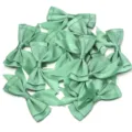 Close-up detail of sage green polyester double-layer swallowtail ribbon bows for DIY craft. - 2.5cm Width (10 Pieces/Pack) / Green