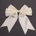 Detailed view of the cream satin double-tail bow accessory, featuring smooth glossy texture. - 4cm Width (10 Pieces/Pack) / Off White