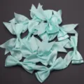 Light blue satin swallowtail bows for DIY craft, hair clips, and gift wrapping accessories. - 2.5cm Width (10 Pieces/Pack) / Blue
