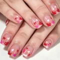 Short square press on nails detail shot featuring cute red and pink heart designs for Valentine day. - Heart Printed Style (YS020)