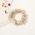 Champagne satin hair scrunchie for women, elegant solid color hair accessory for ponytail. - Light gold
