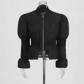 Detail view of the black puff sleeve slim fit winter cotton coat, featuring metal zipper. - S / Tops / Black