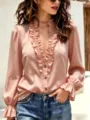 Detailed view of the elegant pink V-neck blouse featuring delicate ruffles and long sleeves. - S / Tops / Pink