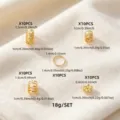Conjunto de anillos de metal dorado para rastas con varios diseños huecos y tamaños. - Dorado