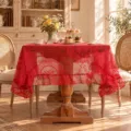 Red lace tablecloth with delicate hollow floral patterns and elegant ruffled edges for vintage home decor. - Christmas Red Mirror Flower (Ruffle Edge)