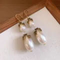 Vintage baroque pearl teardrop earrings with ornate gold-toned metal and crystal accents. - 2# Earrings - Antique Gold