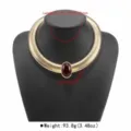 Detail view of the wide snake chain choker necklace with an oval red gemstone accent. - Wide Snake Chain Choker (N13415)