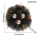 Halloween horror wreath decoration with creepy bleeding skull heads and black mesh fabric. - Horror Head Wreath
