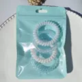 Close-up detail of candy color telephone wire hair ties in blue pouch, elastic spiral bands. - Macaron 4-Piece Set (Blue)