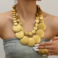 Bohemian wooden disc statement necklace and earrings set for women, bold African style. - Gold
