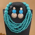 Boheemse turquoise houten kralen meerlaagse statement ketting en bijpassende oorbellen set. - Hemelsblauw