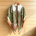 Detailed view of luxury style printed square silk scarf, elegant green and orange accessory. - 130FJ50-Green