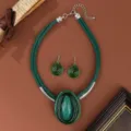 Green leather cord necklace and earrings set with resin drop pendant and wire woven details. - Green