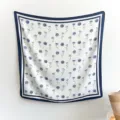 Detail view of Korean style blue floral imitation silk square scarf with elegant border. - 90FJ330-Navy Blue