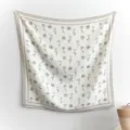 Detailed close-up of the Korean style rose floral print imitation silk large square scarf. - 90FJ330-Khaki