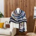 Cotton blend printed scarf detail showing abstract blue patterns and elegant dark striped borders. - LM460-Blue