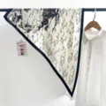 Black and white printed triangular silk scarf, retro equestrian design, elegant neck accessory for women. - White