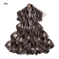 Detailed view of long printed scarf featuring animal leopard and snakeskin pattern design. - Style #6
