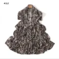 Detailed view of long animal print scarf featuring soft mercerized cotton fabric. - Style 25