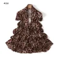 Leopard print scarf detail shot, elegant fabric texture, versatile fashion accessory. - Style 28