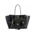 Close-up detail view of black leather tote bag featuring stylish turn-lock front pockets. - With Letters / L / Black & Gold