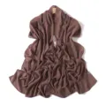 Detail view of a plain brown chiffon long scarf, showing soft draped texture and lightweight fabric. - Brick Tea Color