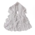 Detailed view of white chiffon scarf featuring delicate floral embroidery edges and soft drape. - Cream White