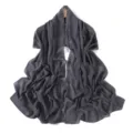 Dark grey chiffon scarf detail showing elegant floral embroidery and smooth drape texture. - Smoke Gray