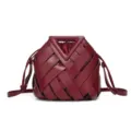 Burgundy Woven Leather Bucket Bag with Iconic Triangle Handle and Adjustable Strap. - Burgundy