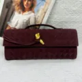 Burgundy woven leather clutch bag for women, chic evening bag with stylish metal knot closure. - Burgundy