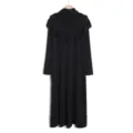 Detailed view of this elegant black long-sleeve maxi dress with draped hijab and ruffles. - One Size / Dresses / Black