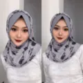 Close-up detail view of grey pleated mesh floral print hijab head cover, elegant accessory. - One Size / Tulip Gray