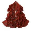Detailed view of the red chiffon hijab scarf featuring exquisite rhinestone spiral design. - 18# Caramel Color