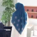Detailed view of dark blue chiffon hijab featuring elegant rhinestone rose patterns and sparkling stones. - 5# Indigo Blue