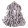 Close up detail of sparkling rhinestone chiffon scarf shawl, shimmering silver fabric texture. - Agate Gray